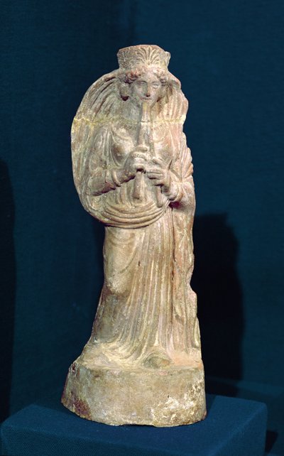 Statuette of a Woman Playing a Double Flute, from Tunisia by Punic